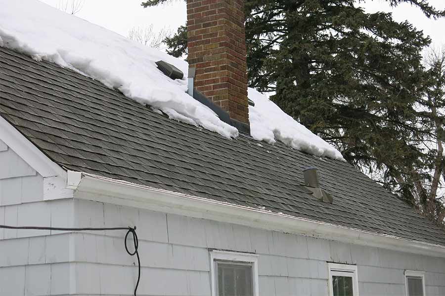 Shingled roof after ice dam has been removed and cleared out.