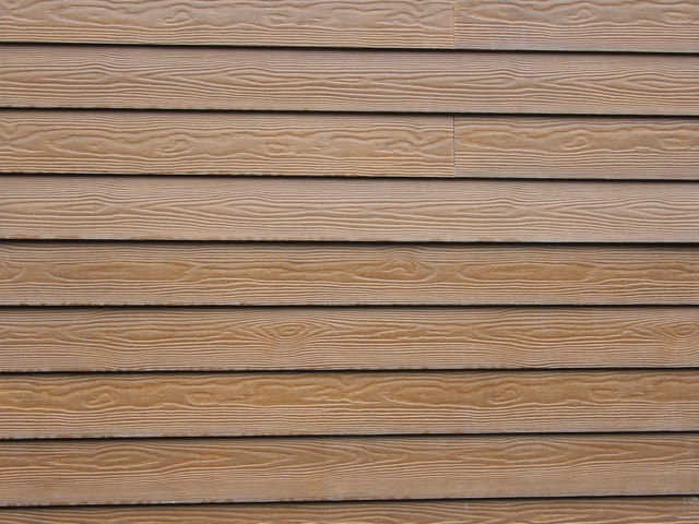 Close up view of brown Hardie plank siding.