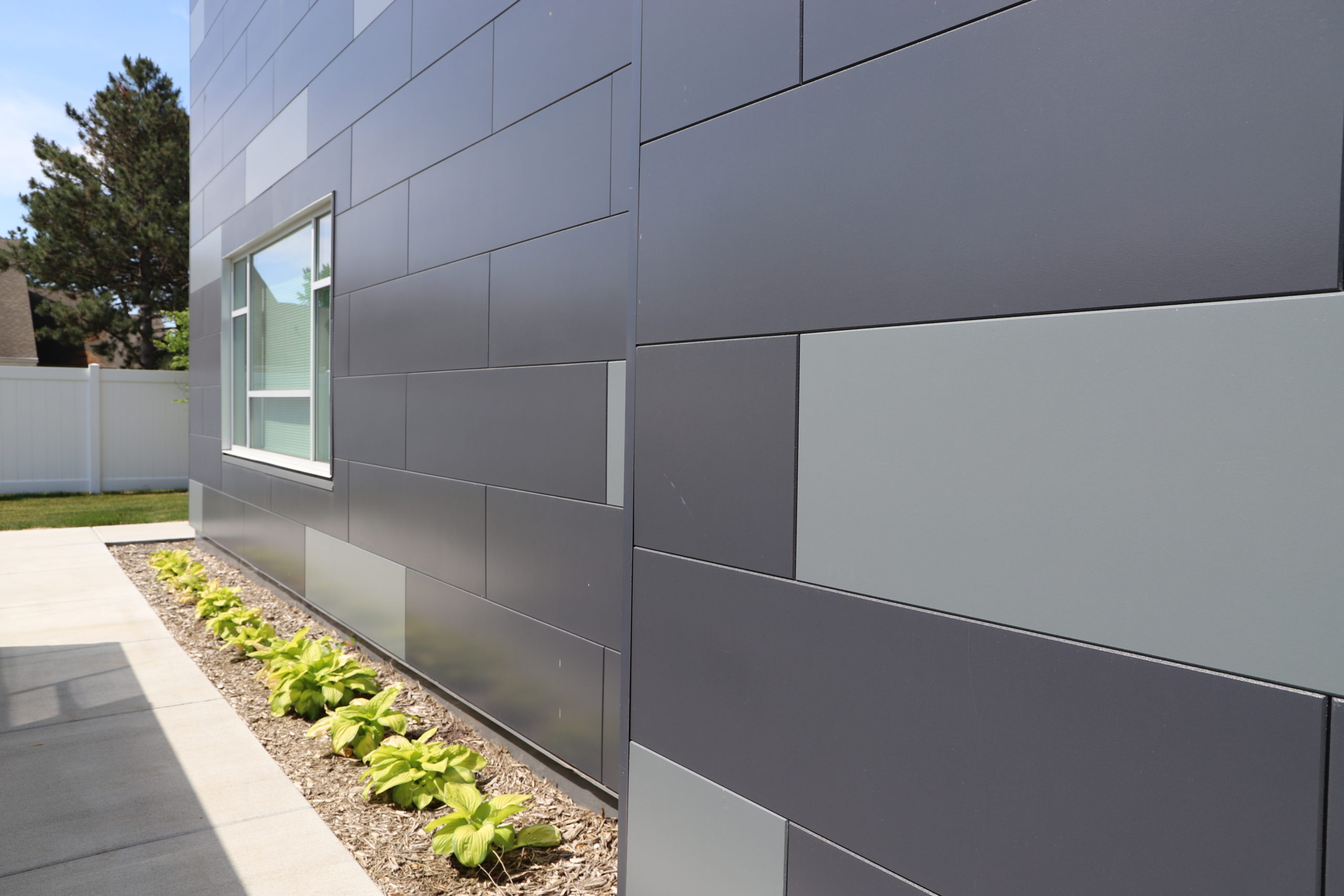 Close up on the side of commercial building with Nichiha Illumination Panels on exterior in Apple Valley, MN.