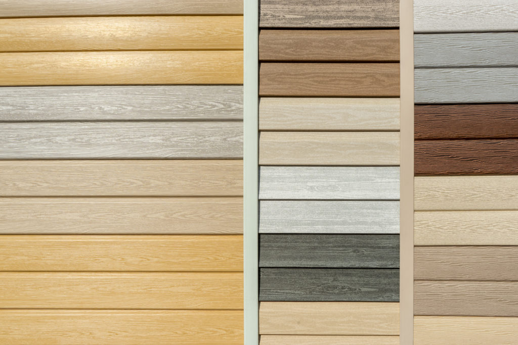 Vinyl siding with imitation wood texture in bright palette of colors.