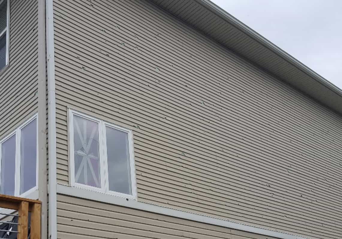 siding damage from severe hail storm and high winds