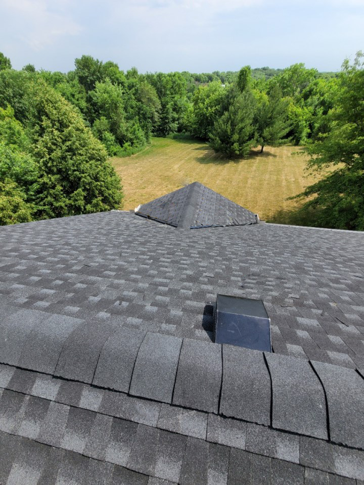 A roof with a sleek black shingled roof, instantly boosting your home's curb appeal and value.