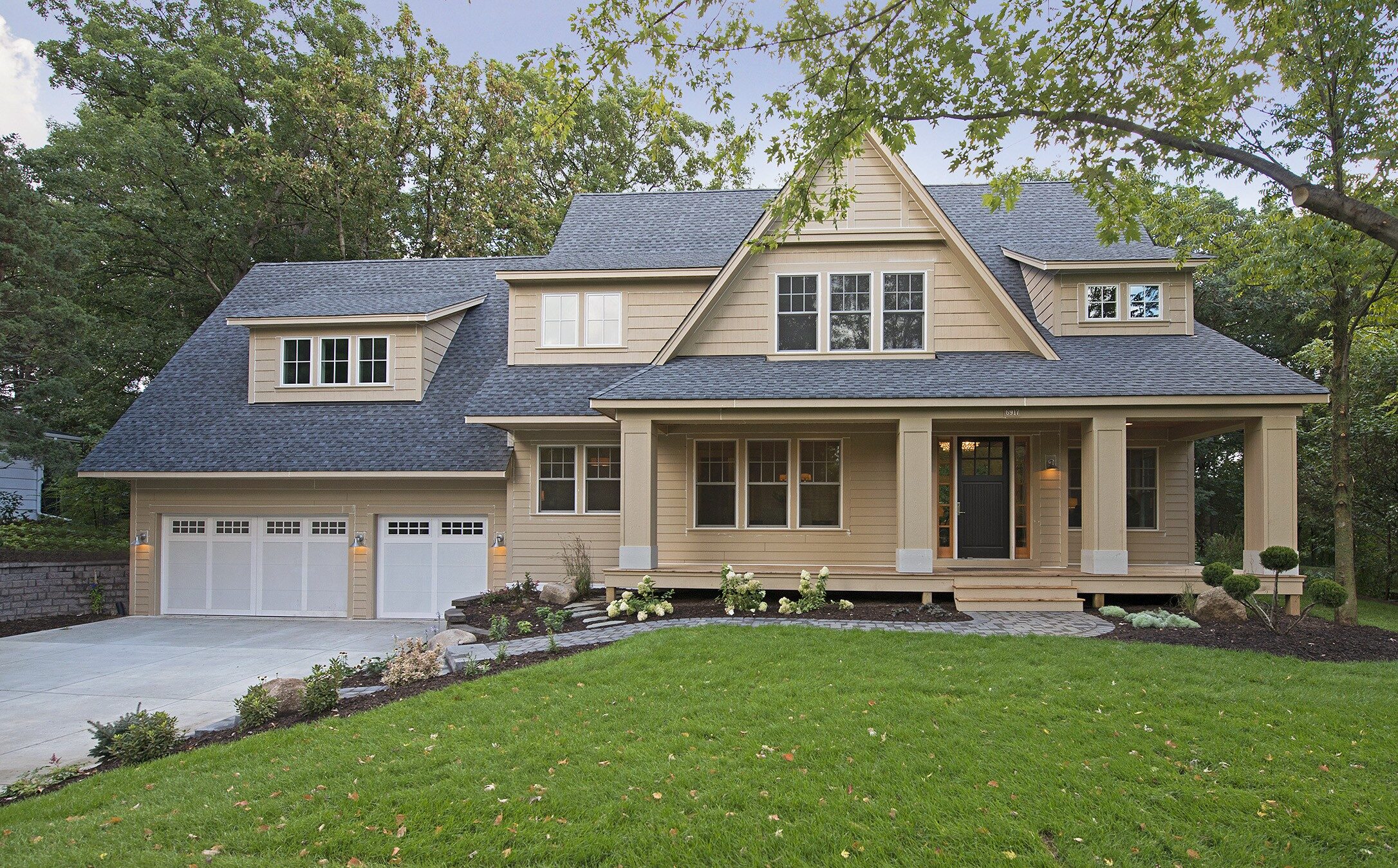 A home with a large front yard and a garage, designed and built by Exteriors by Highmark in Savage, Minnesota.
