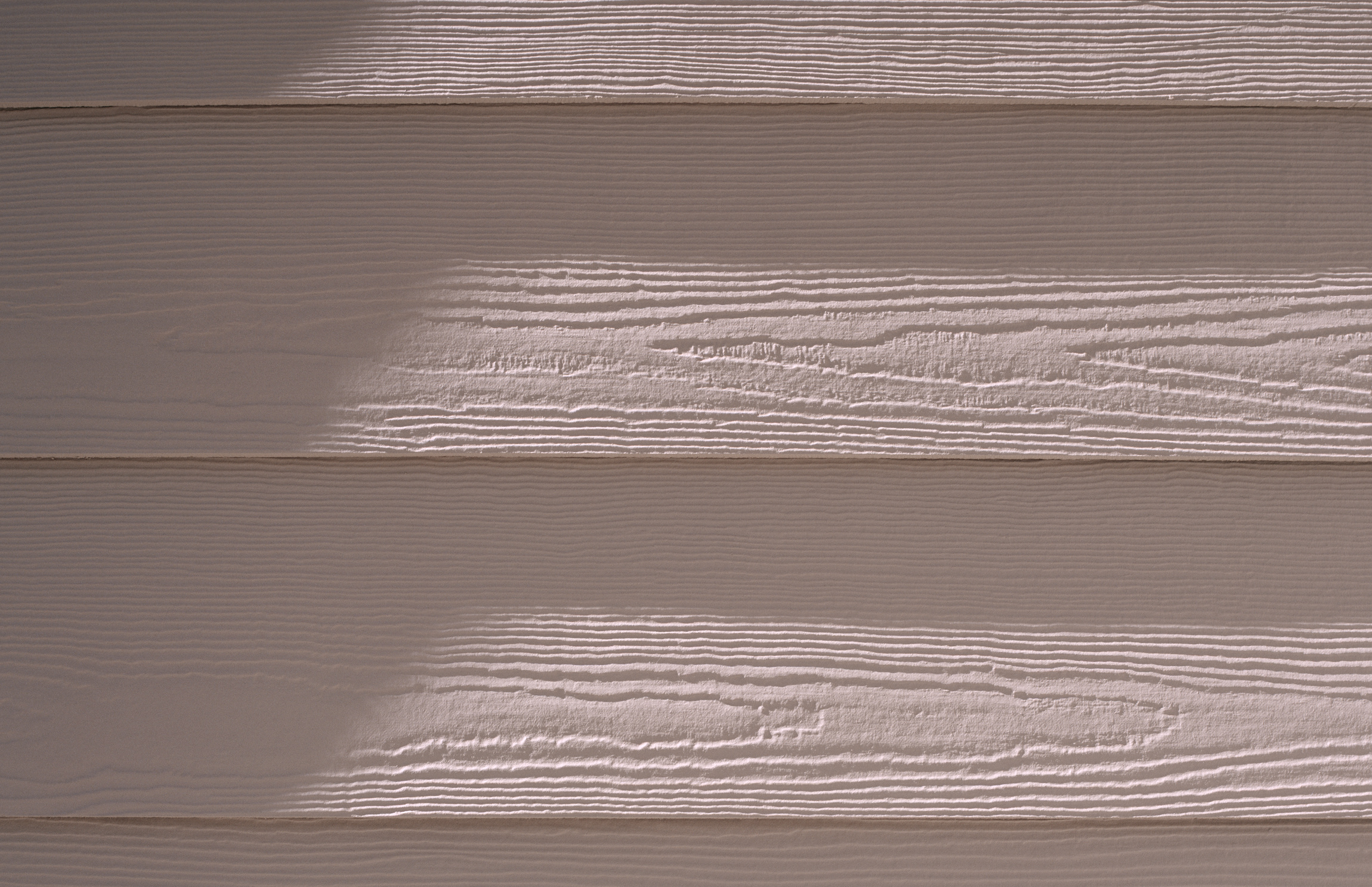 An ultimate home siding guide featuring a house with white siding illuminated by a captivating light.